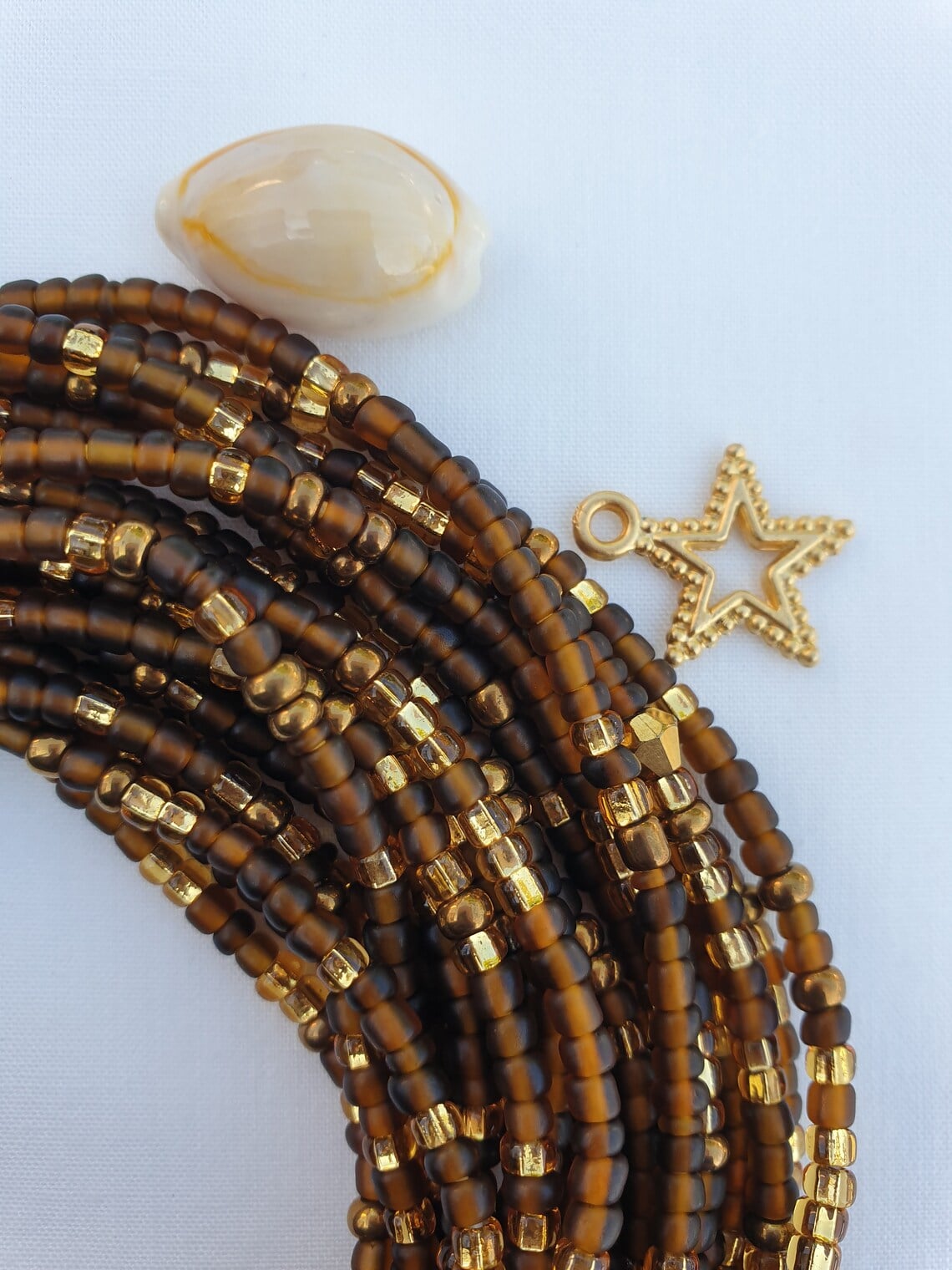WAIST BEADS IN WARM TONES OF BROWN AND GOLD HAND MADE IN GHANA